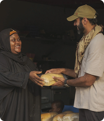 Man handing bread